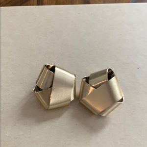 Gold Alexis Bittar pierced studs.
